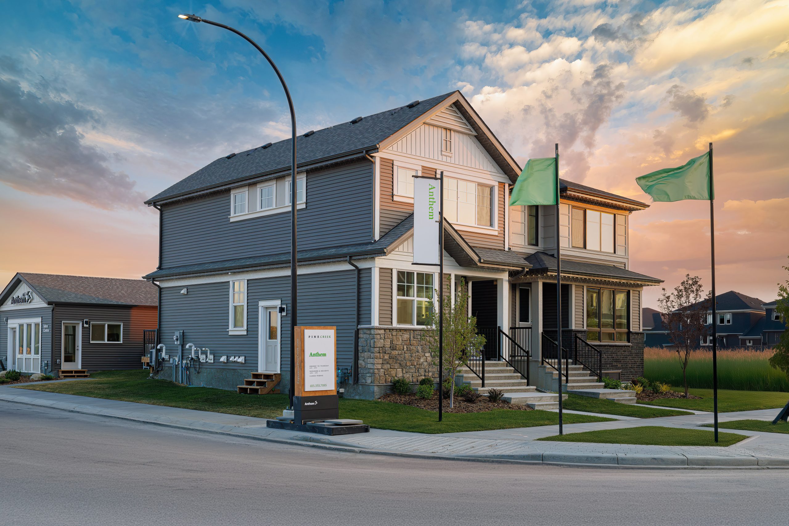 Quiet streetscape in Pine Creek, SW Calgary, featuring Zero Lot Line detached homes and a family-friendly neighbourhood setting.